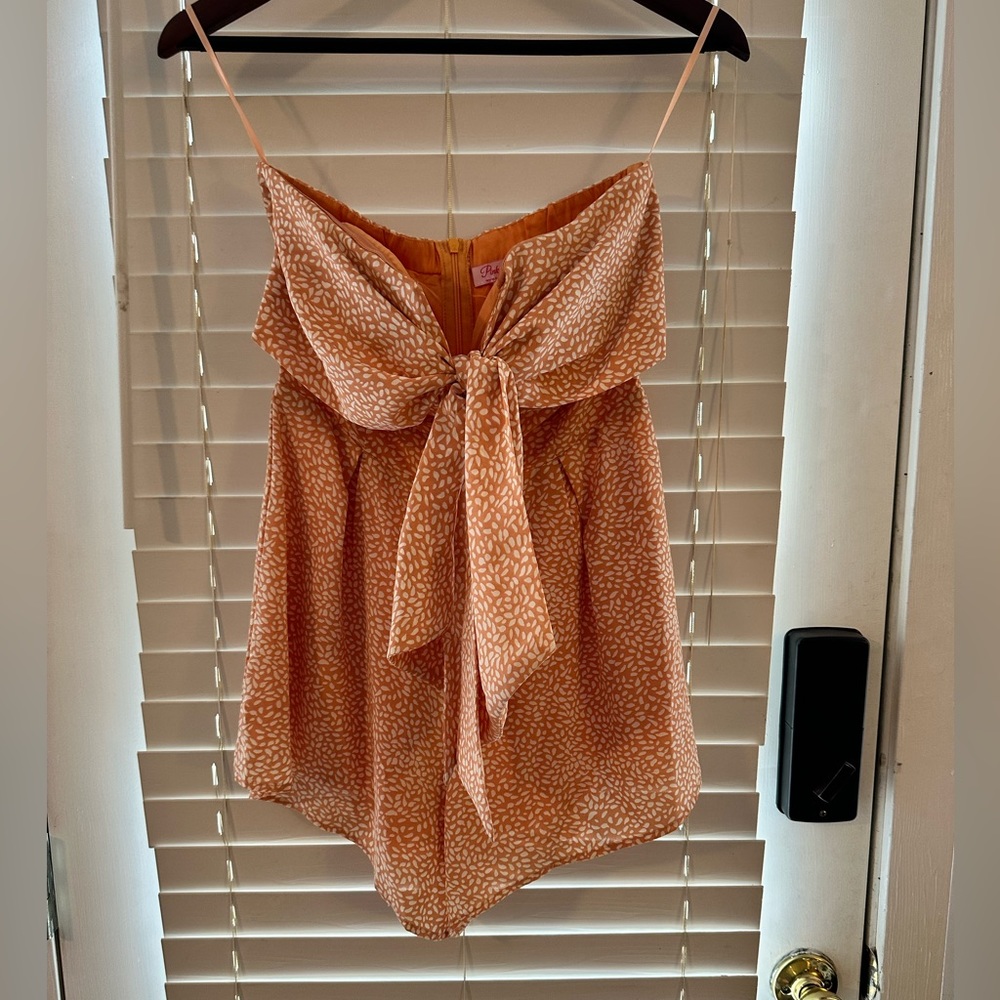Women’s v neck romper with bow